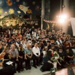南大師長與各校貴賓專注欣賞原住民族歌舞演出，感受文化傳承之美。南大以文化活動深化族群認同，讓師生在共鳴中見證原民青年的自信與能量。